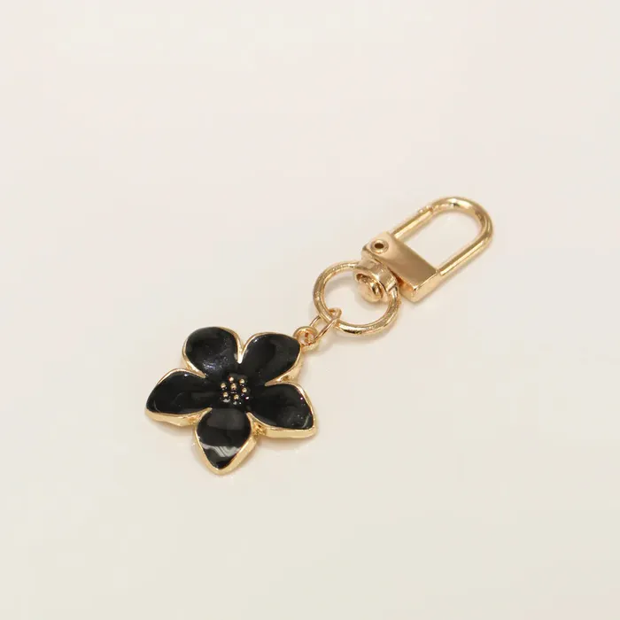 Candlewick Gift Shop Earrings Key Bag Charm Black Plumeria