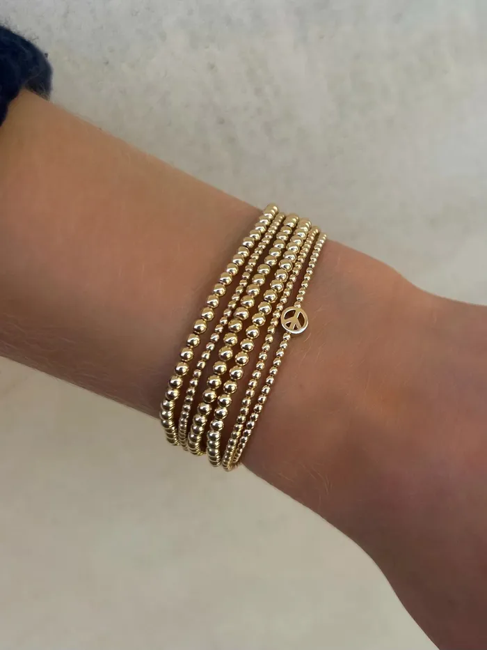 Karen Lazar Bracelets 2mm Signature Bracelet With 14K Peace Sign Bead Karen Lazar Bracelets 2mm Signature Bracelet With 14K Peace Sign Bead