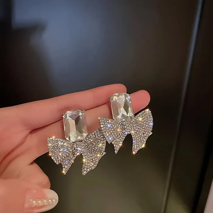Yellow Chimes Necklaces Yellow Chimes Earrings For Women Silver Tone Crystal Studded Bow Knot Shape Stud Earrings For Women and Girls