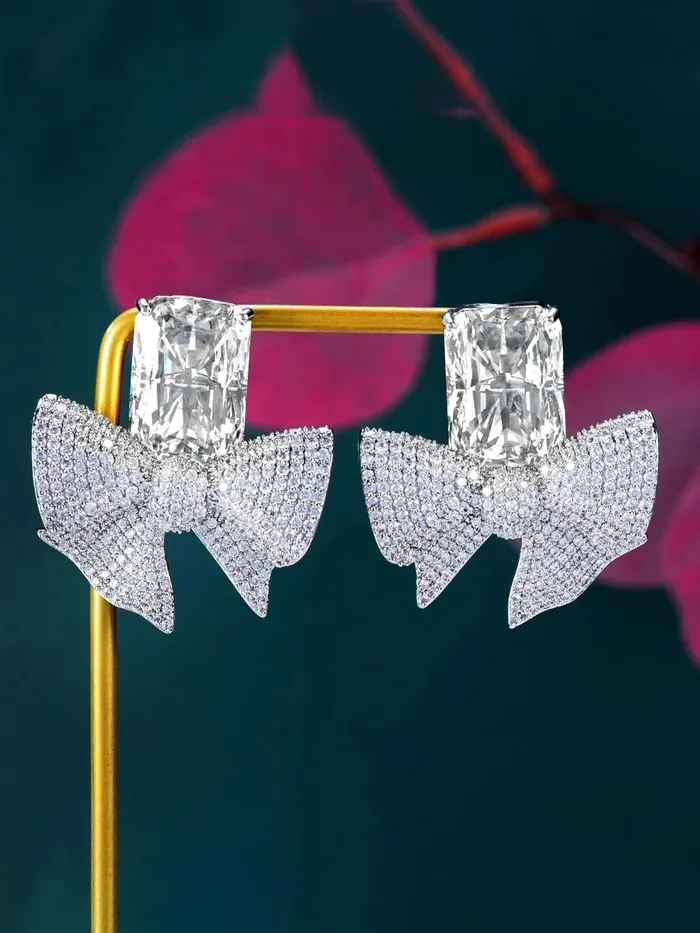 Yellow Chimes Necklaces Yellow Chimes Earrings For Women Silver Tone Crystal Studded Bow Knot Shape Stud Earrings For Women and Girls