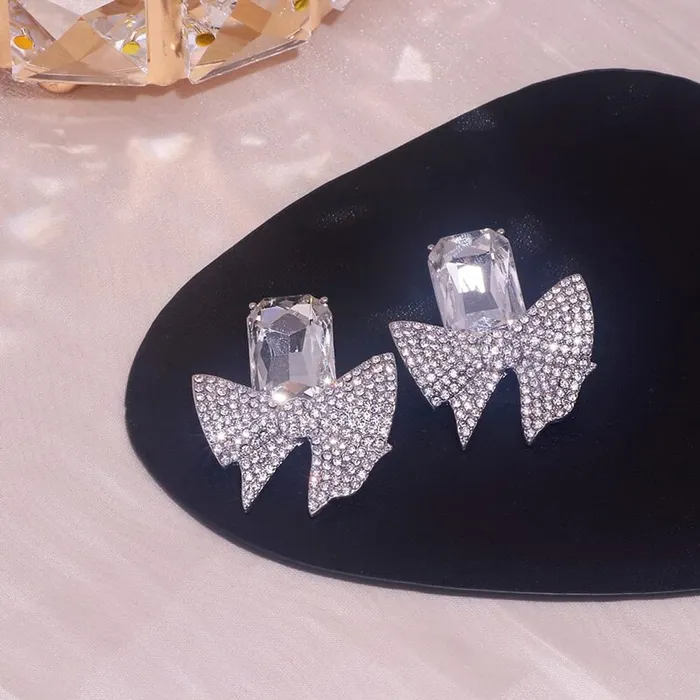 Yellow Chimes Necklaces Yellow Chimes Earrings For Women Silver Tone Crystal Studded Bow Knot Shape Stud Earrings For Women and Girls