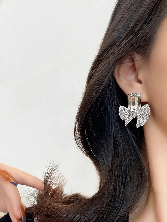 Yellow Chimes Necklaces Yellow Chimes Earrings For Women Silver Tone Crystal Studded Bow Knot Shape Stud Earrings For Women and Girls