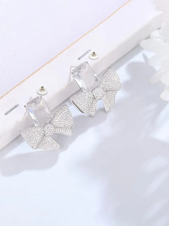Yellow Chimes Necklaces Yellow Chimes Earrings For Women Silver Tone Crystal Studded Bow Knot Shape Stud Earrings For Women and Girls